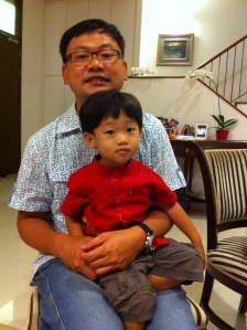 Day 2 of Chinese New Year - Caleb in his red samfu